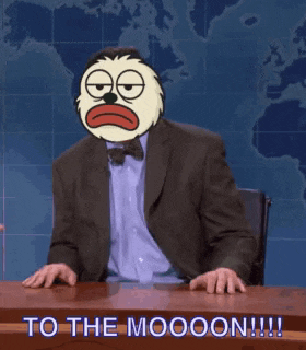 a man in a suit with a cartoon face on his head says " to the moooon !!! "