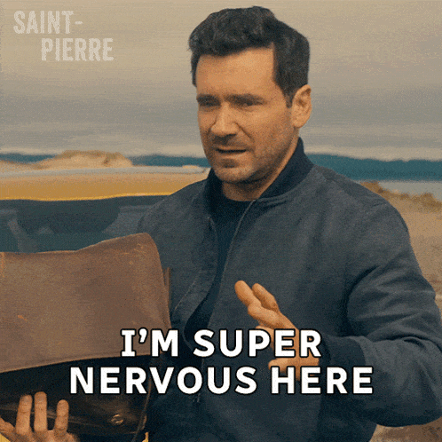 a man is holding a briefcase and says i 'm super nervous here