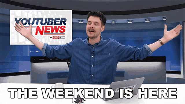 a man is sitting in front of a youtuber news sign