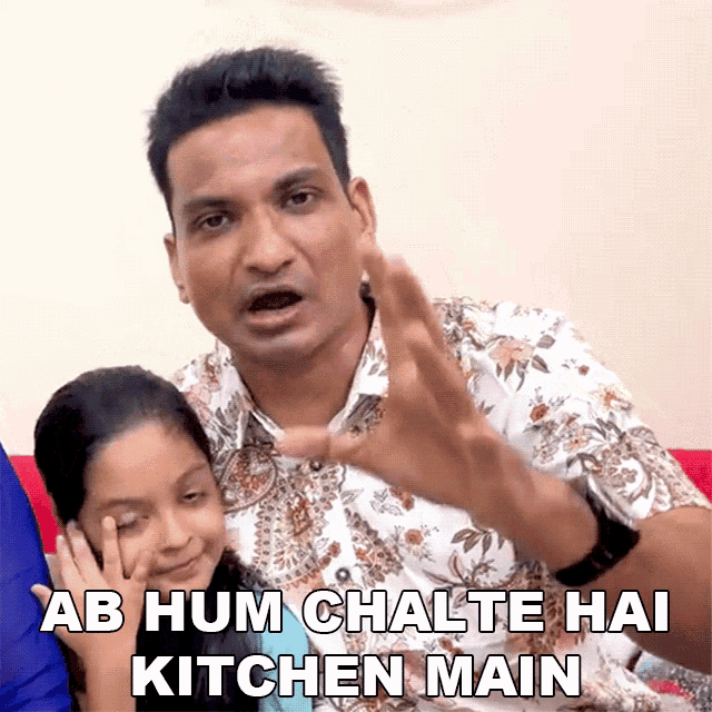 a man and a little girl are sitting on a couch with a caption that says ab hum chelte hai kitchen main