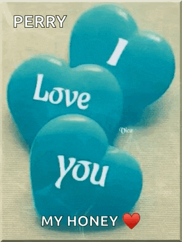 three blue hearts with the words `` i love you '' on them .