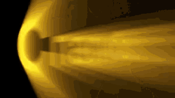 a yellow light coming out of a hole in the dark