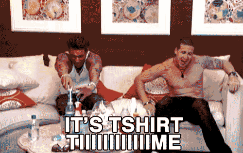 two shirtless men sit on a couch with the words it 's tshirt time written on the bottom