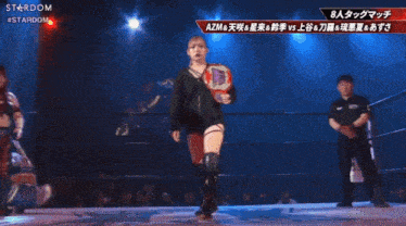 a female wrestler named azusa is shown on a television screen