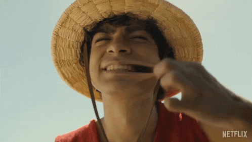 a man wearing a straw hat with a netflix logo on the bottom right