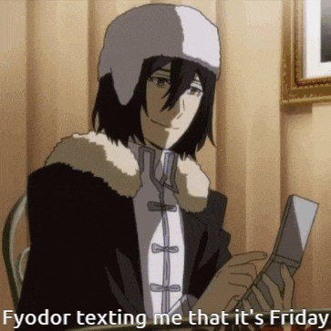a man in a hat is holding a cell phone and texting someone that it 's friday