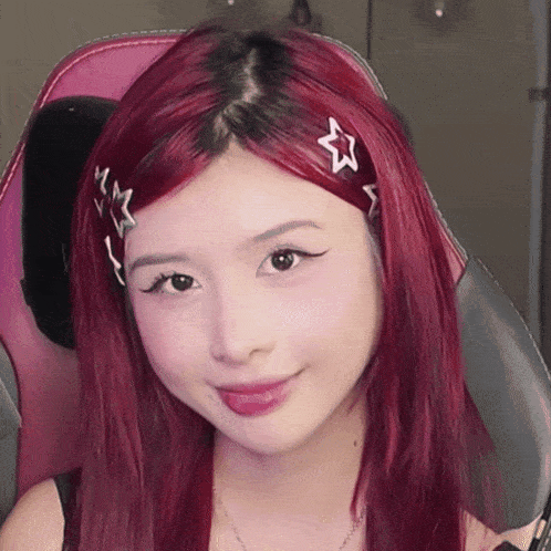 a girl with red hair has a star in her hair