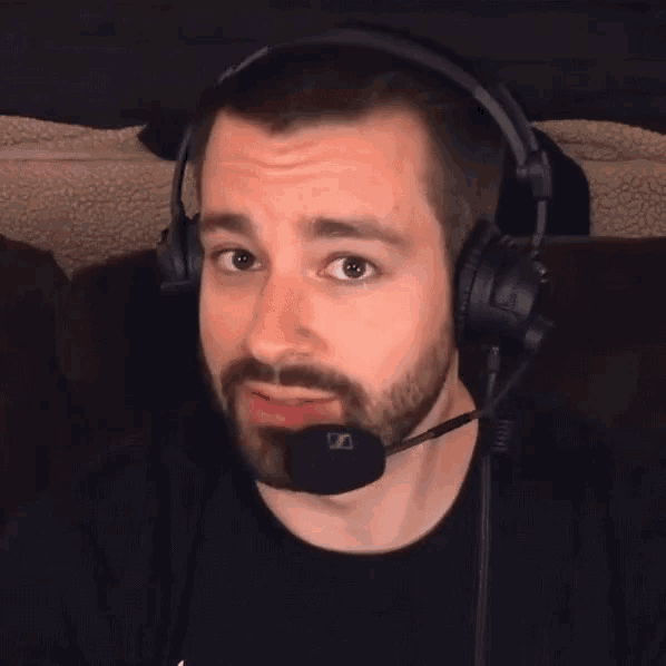 a man wearing headphones and a microphone with the word really above him