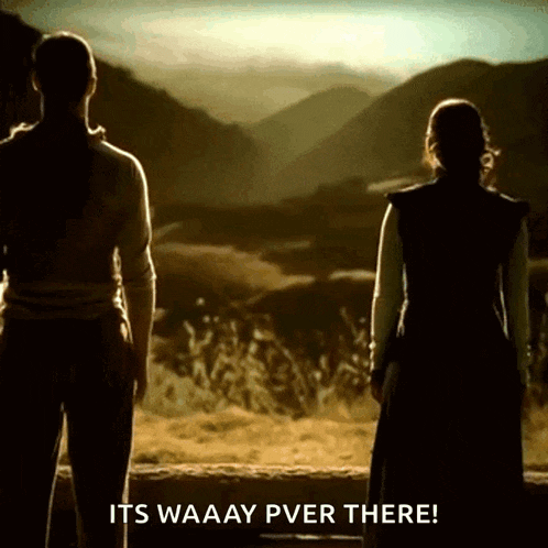 two women standing in front of a mountain with the words " its waaay pver there "