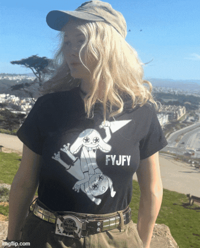 a woman wearing a black shirt that says fyjfy on it