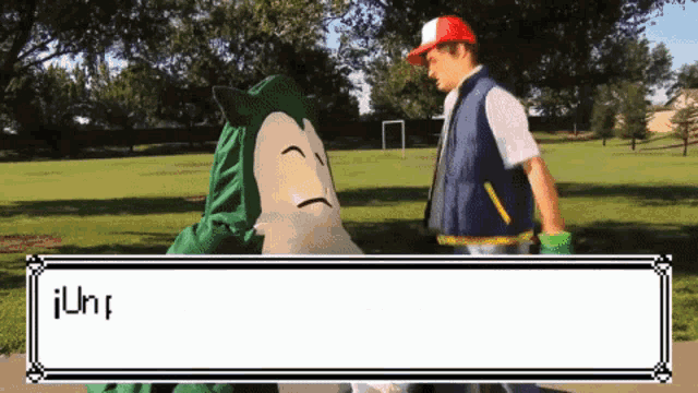 a man in a pokemon costume talks to a snorlax in a park