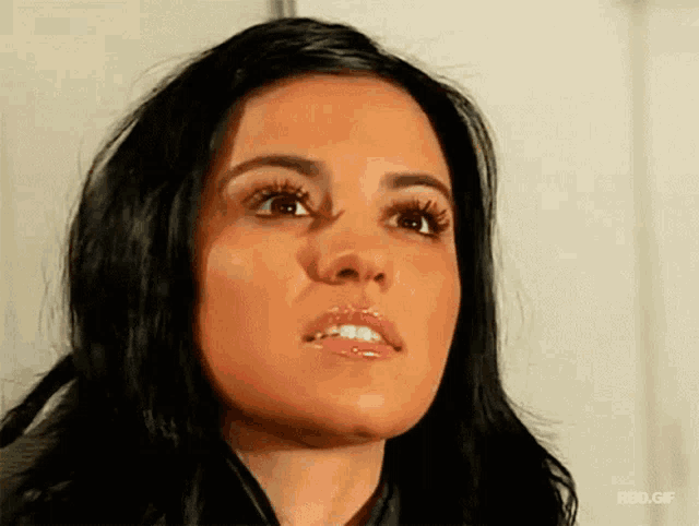 a close up of a woman 's face with a rbd.gif watermark at the bottom