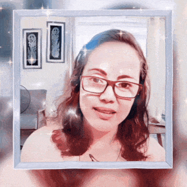 a picture of a woman with glasses in a white frame