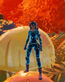 a woman in a blue suit is standing in front of a large sphere in a video game