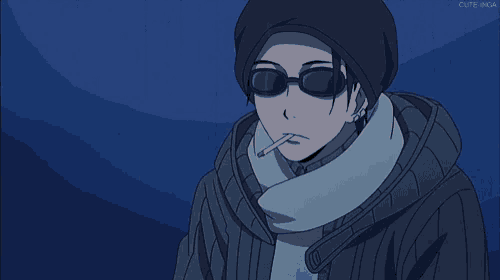a man wearing sunglasses and a beanie holds a cigarette in his mouth ..