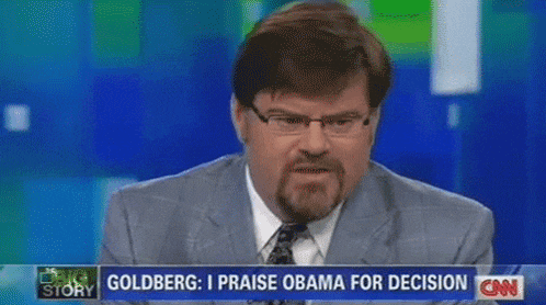 a man in a suit and tie is on a cnn news channel