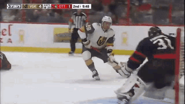 a hockey game between the golden knights and the toronto maple leafs is being played