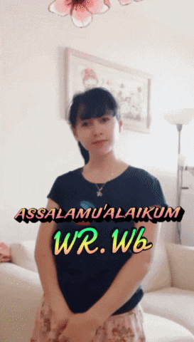 a woman is standing in front of a couch with the words assalamu'alaikum wr.wb written on the bottom