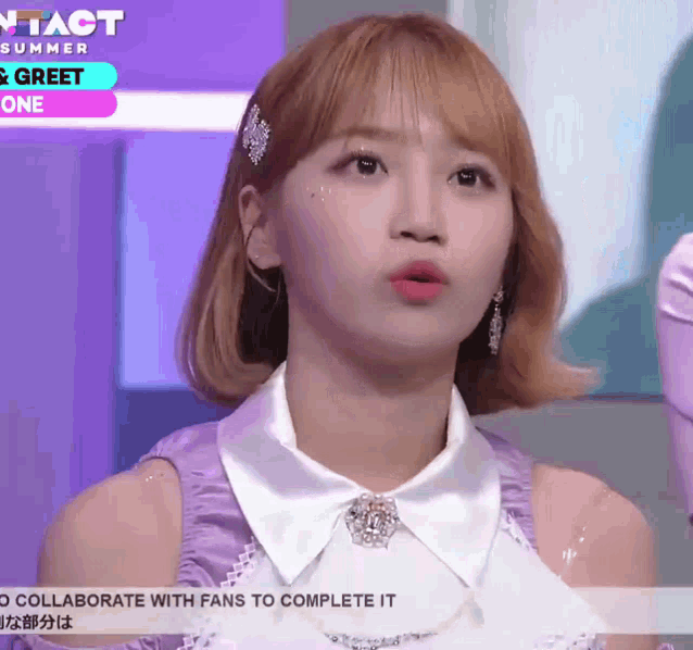 a girl is wearing a purple dress and a white collar with the words " collaboration with fans to complete it " on the bottom