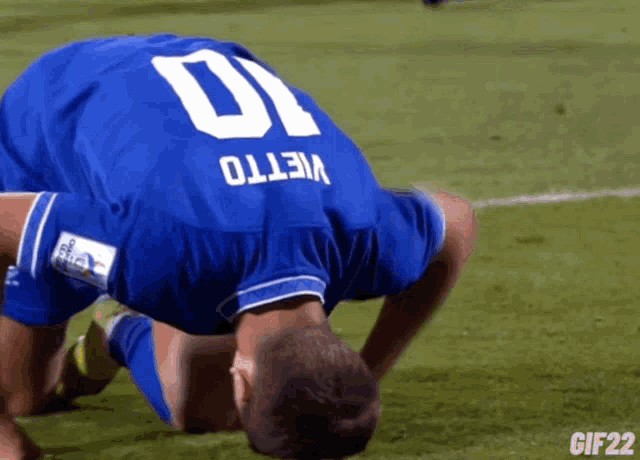 a soccer player in a blue jersey with the number 10 on it