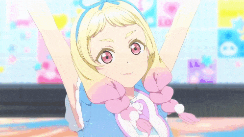 a girl with blonde hair and pink braids is wearing a blue dress and a blue headband