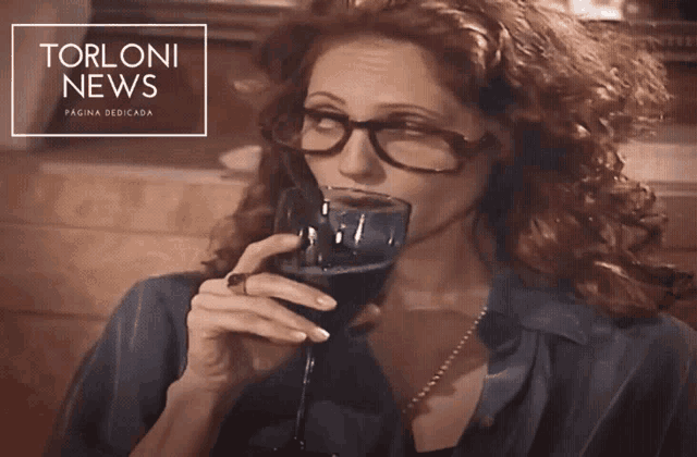 a woman drinking a glass of wine with the words torloni news on the bottom