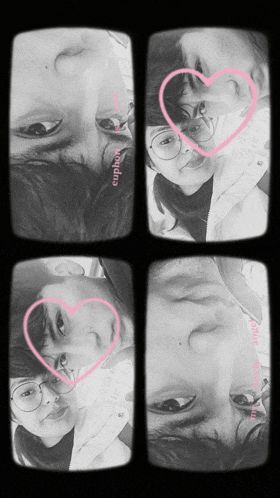 a black and white photo of two people with pink hearts and the word euphoria on the bottom