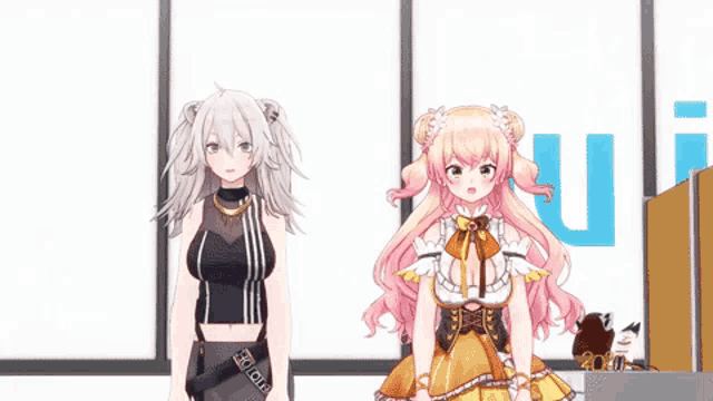 a couple of anime girls standing next to each other .