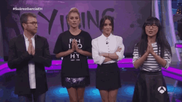 a group of people are kneeling down in front of a wall that says vibing