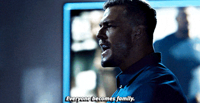 a man says everyone becomes family in front of a mirror