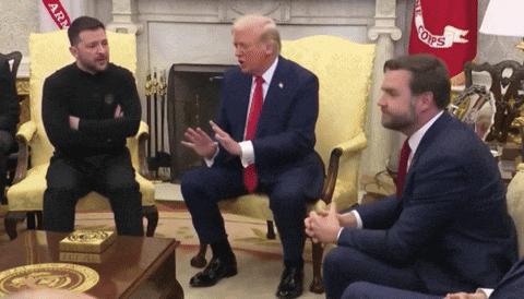 a group of men are sitting around a table with a flag that says army