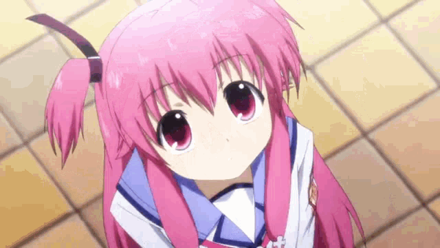 a girl with pink hair and red eyes is wearing a school uniform .