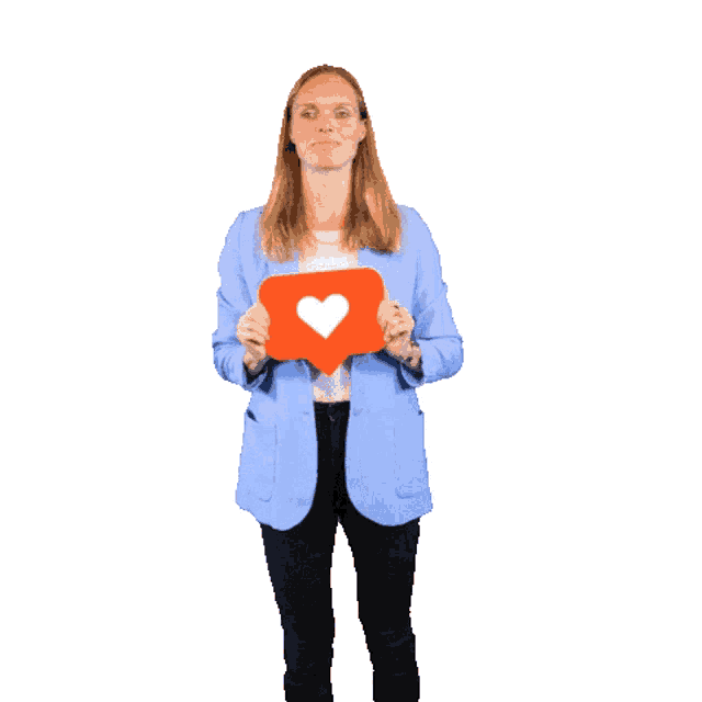 a woman in a blue jacket is holding a heart shaped icon