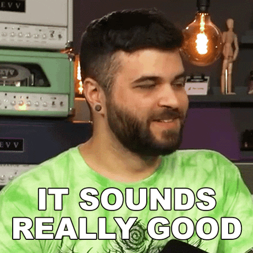 a man with a beard is wearing a green tie dye shirt and says it sounds really good