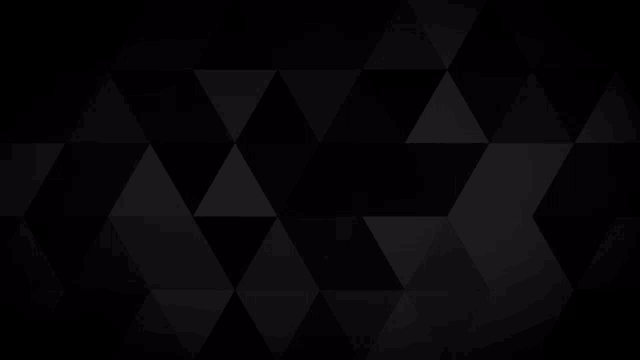 a black background with a pattern of black triangles on it