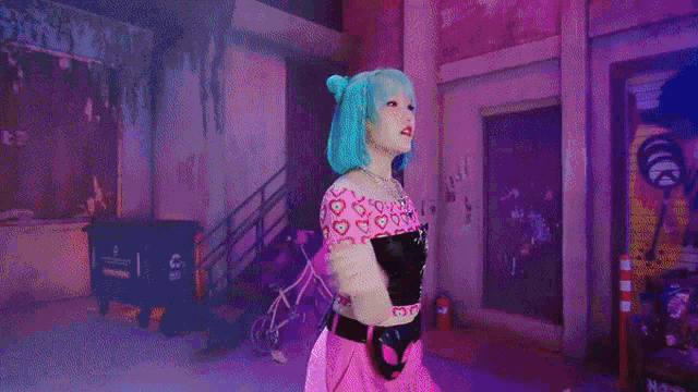 a woman with blue hair is dancing in front of a sign that says are you lost