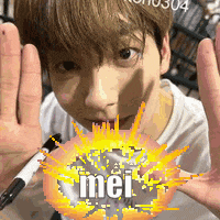 a young boy is making a funny face with his hands up and the word mei in the middle