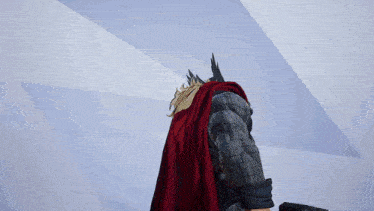 a man in a red cape with the word thor on the back