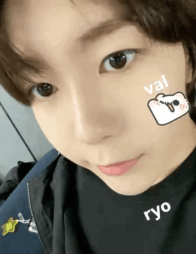 a close up of a person 's face with a sticker on it that says ryo .