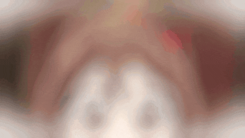 a blurred image of a person 's face with a white background