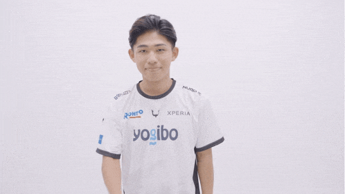 a young man wearing a white shirt that says xperia on it