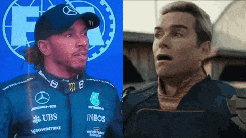a race car driver and a man from the movie the boys are standing next to each other .