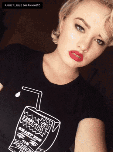 a woman is wearing a black shirt that says bitch juice