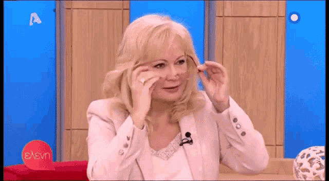 a woman on a tv show with the letter a on the bottom