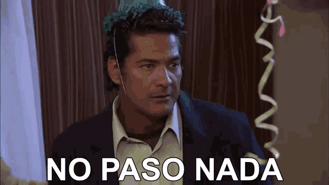 a man wearing a party hat with the words no paso nada written below him