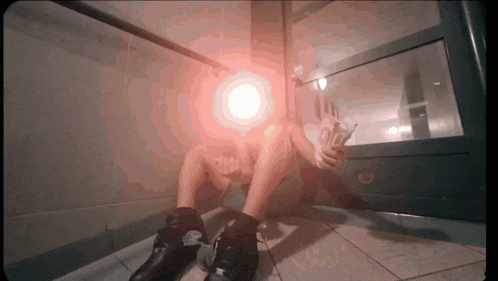 a person is sitting on the floor holding a bunch of money in their hand