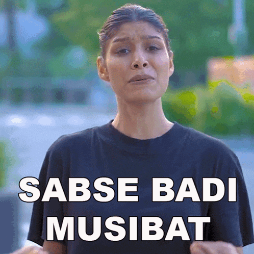 a woman wearing a black shirt with the words sabse badi musibat written on it