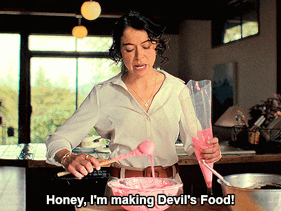 a woman in a white shirt is making devil 's food and says honey i 'm making devil 's food