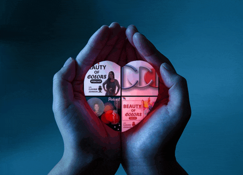 a person is holding a heart with the words beauty of colors visible