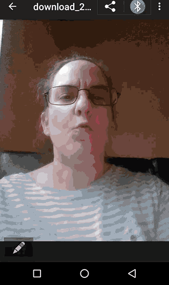 a screenshot of a woman 's face with the words download 2 on the top